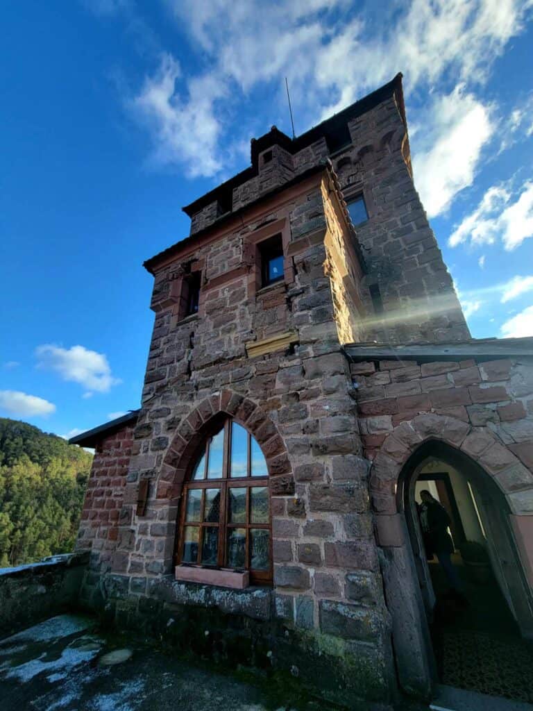 A view of the tower with arched window and doorway from a terrace on the third floor.