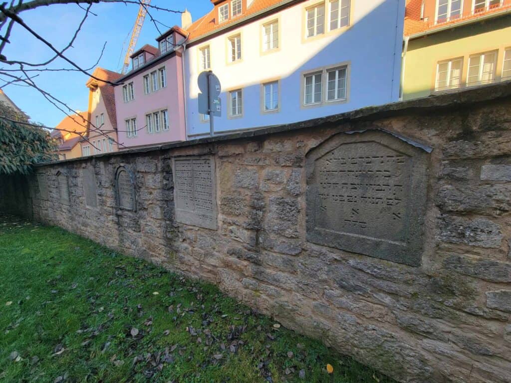 A wall with medieval Jewish tombstones, written in Hebrew