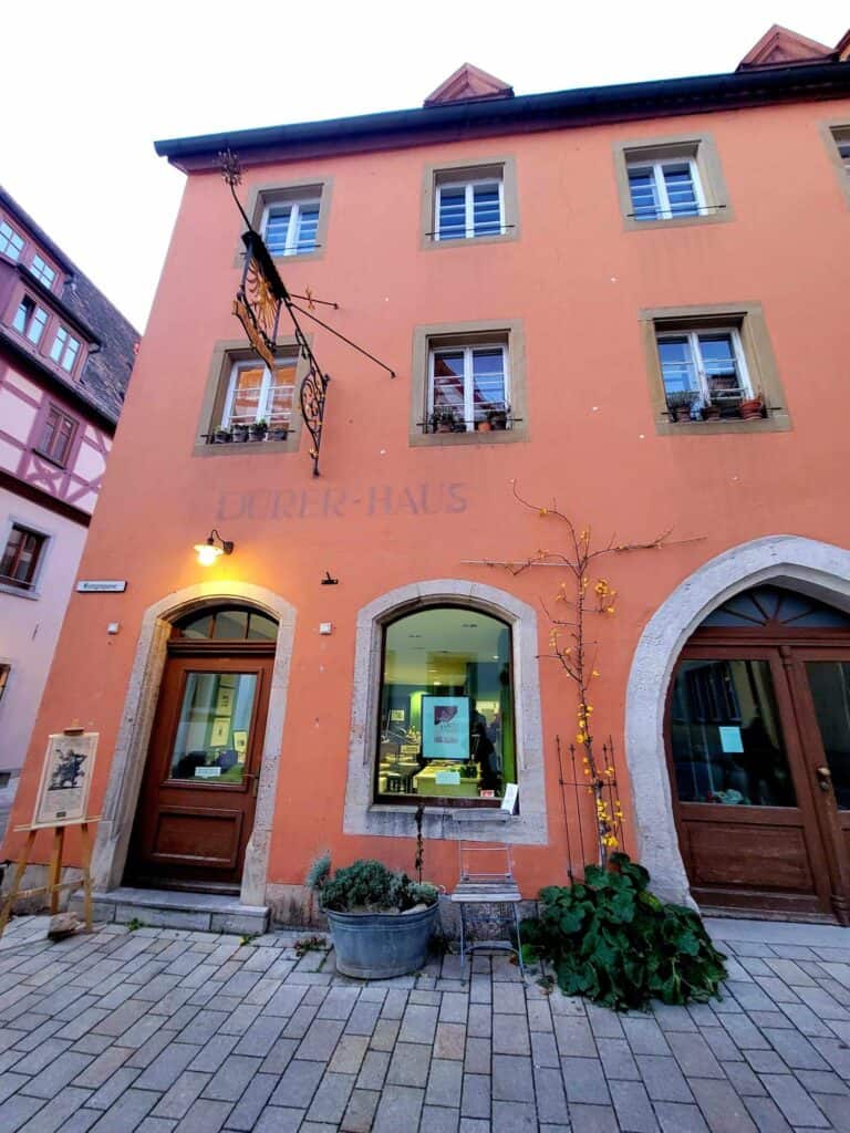 A pink building with square windows