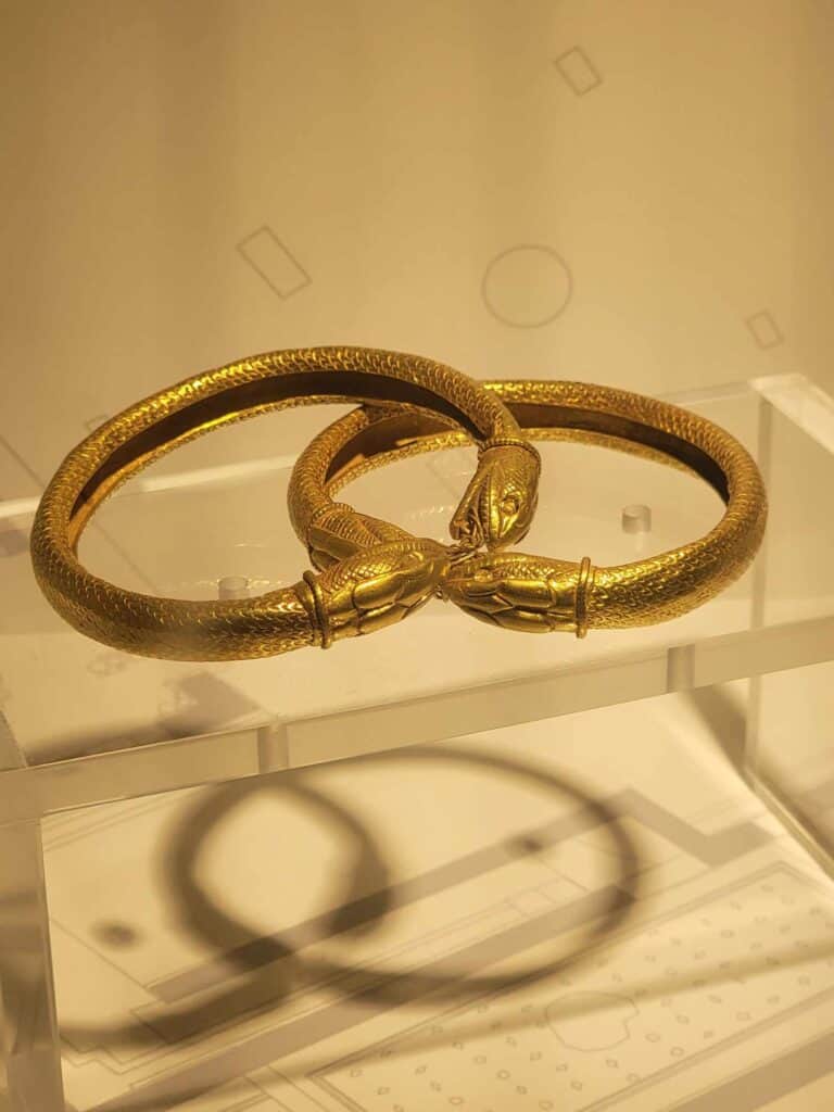 Pompeii vs. Herculaneum: Best Tips & Biggest Differences 26 Two thick gold bracelets shaped like snakes