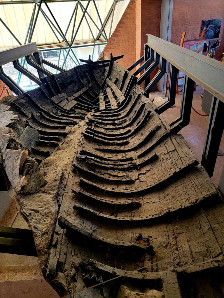 Pompeii vs. Herculaneum: Best Tips & Biggest Differences 24 The inside of the hull of a preserved wooden boat from Herculaneum