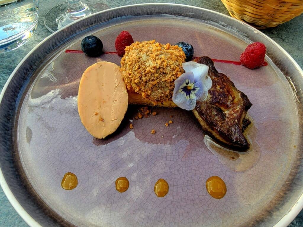 Best 2 Day Dordogne Prehistory Itinerary: What to See & Do 7 Three types of fois gras with berries and a pansy garnish
