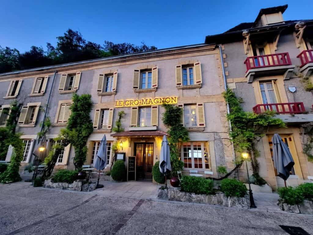 Best 2 Day Dordogne Prehistory Itinerary: What to See & Do 3 The beautiful Cro-Magnon hotel with wooden french doors, and pale yellow window shutters