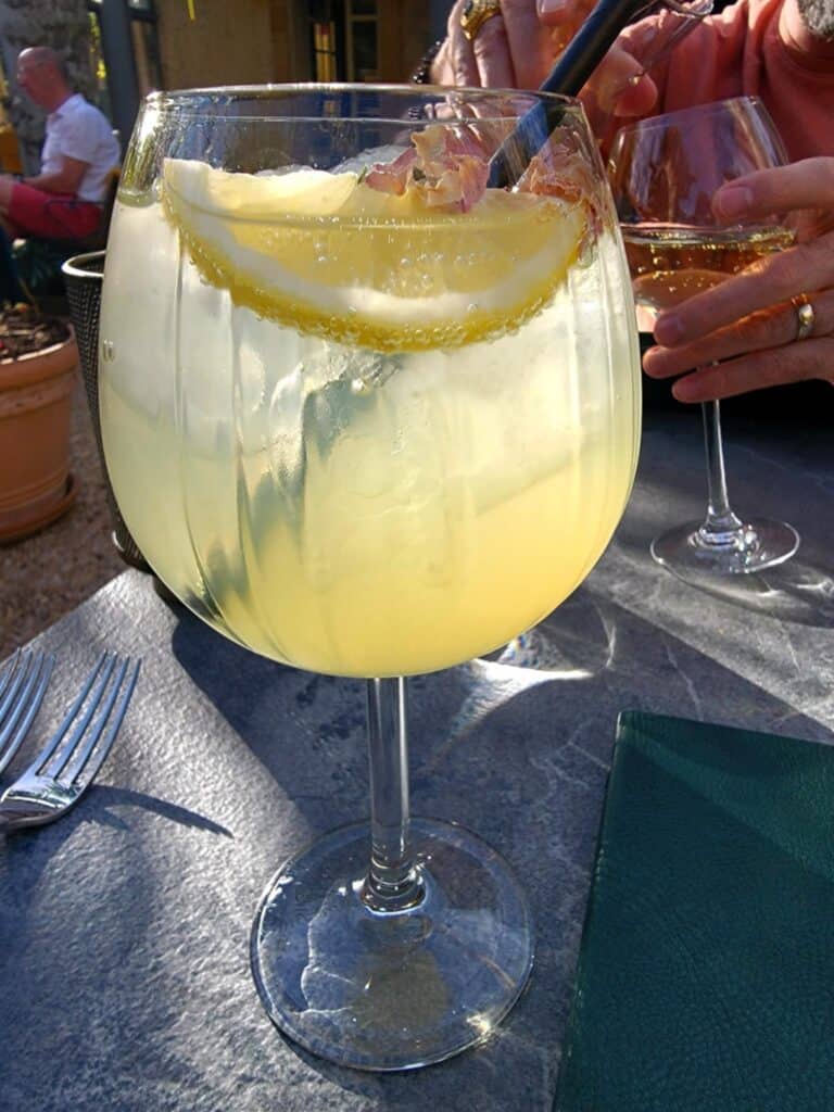Best 2 Day Dordogne Prehistory Itinerary: What to See & Do 8 A limoncello sprits in a large rounded goblet