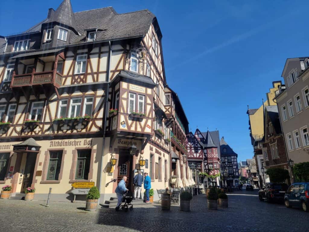 One Day in Bacharach: Best Guide to Germany's Hidden Gem on the Rhine 2 A bustling street filled with half-timbered houses, blue sky
