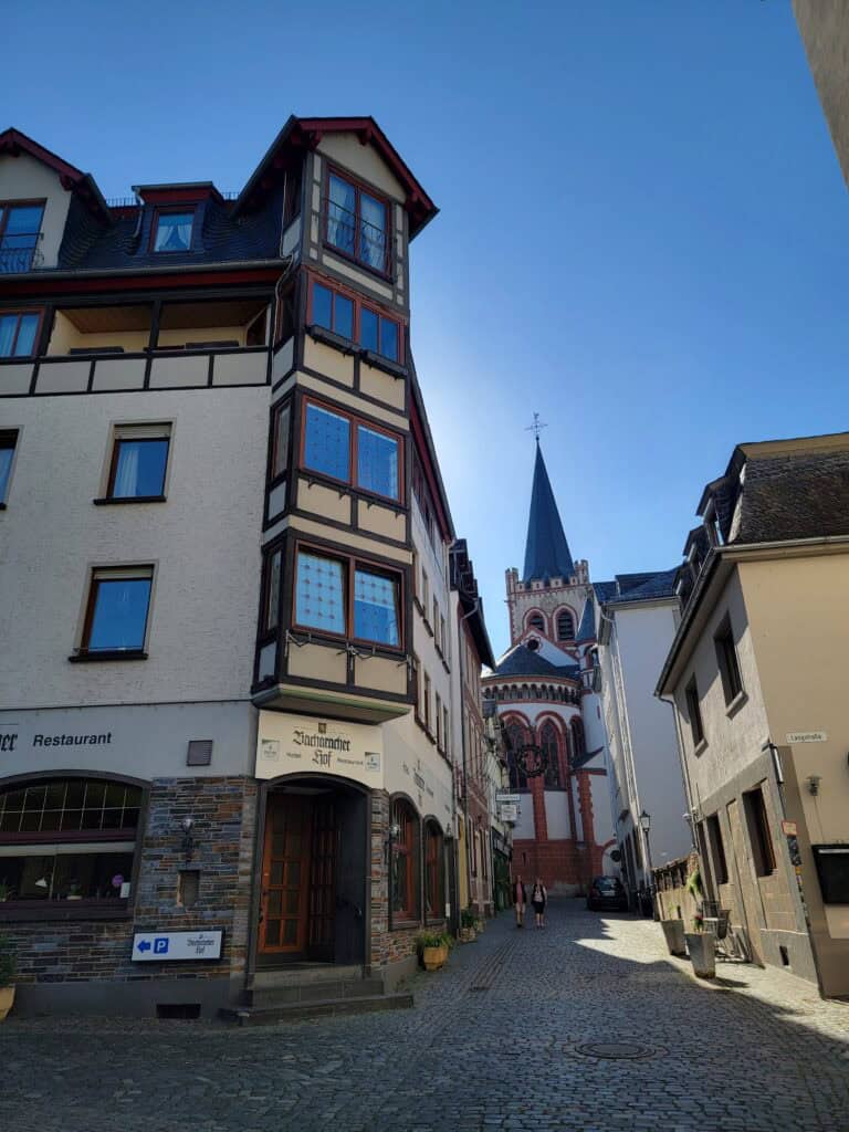 One Day in Bacharach: Best Guide to Germany's Hidden Gem on the Rhine 27 The exterior of the Bacharacher Hof hotel with St. Peter's Church in the background