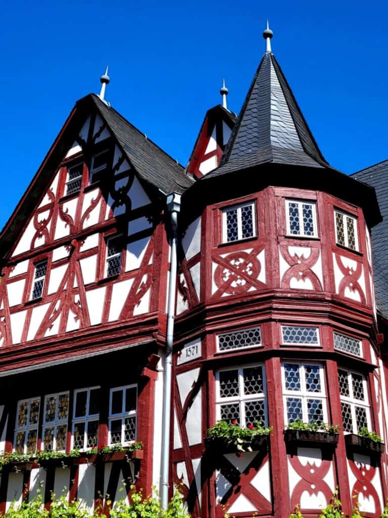 One Day in Bacharach: Best Guide to Germany's Hidden Gem on the Rhine 14 A very elaborately decorated half-timbered house with a dark slate roof and a tower