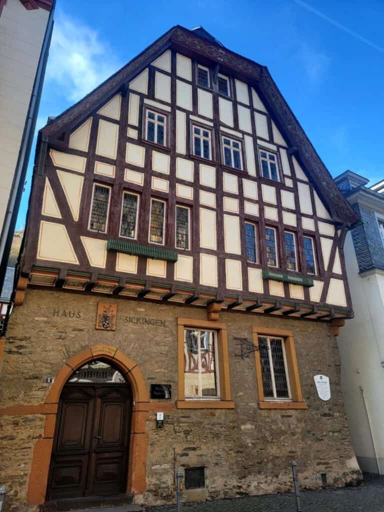 One Day in Bacharach: Best Guide to Germany's Hidden Gem on the Rhine 13 A building with a stone first floor and a rounded door, with half timbered upper floors