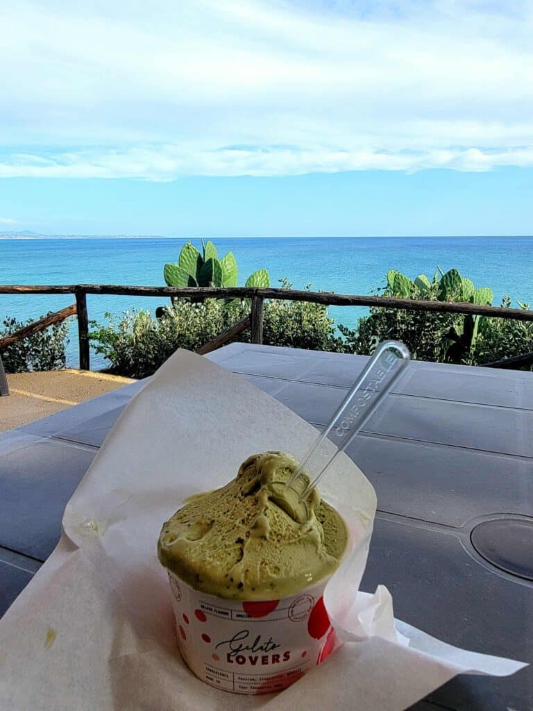 Pistachio gelato with a view of the Mediterranean at Selinunte Archaeological Park in Sicily
