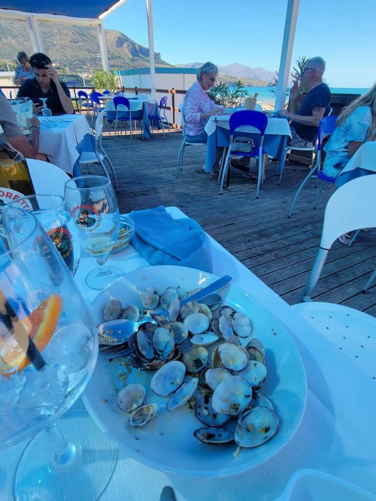 The remnants of clams and pasta at a beachside restaurant in Western Sicily