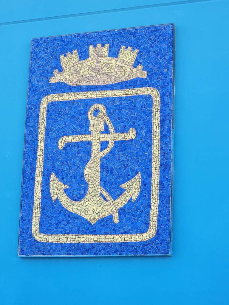 A mosaic anchor on a sign in the Marina in Ravenna Italy