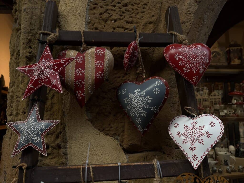 Eguisheim Christmas Market 2026: The Most Beautiful Village in Alsace Delivers 16 Alsacian carved wooden heart and star ornaments