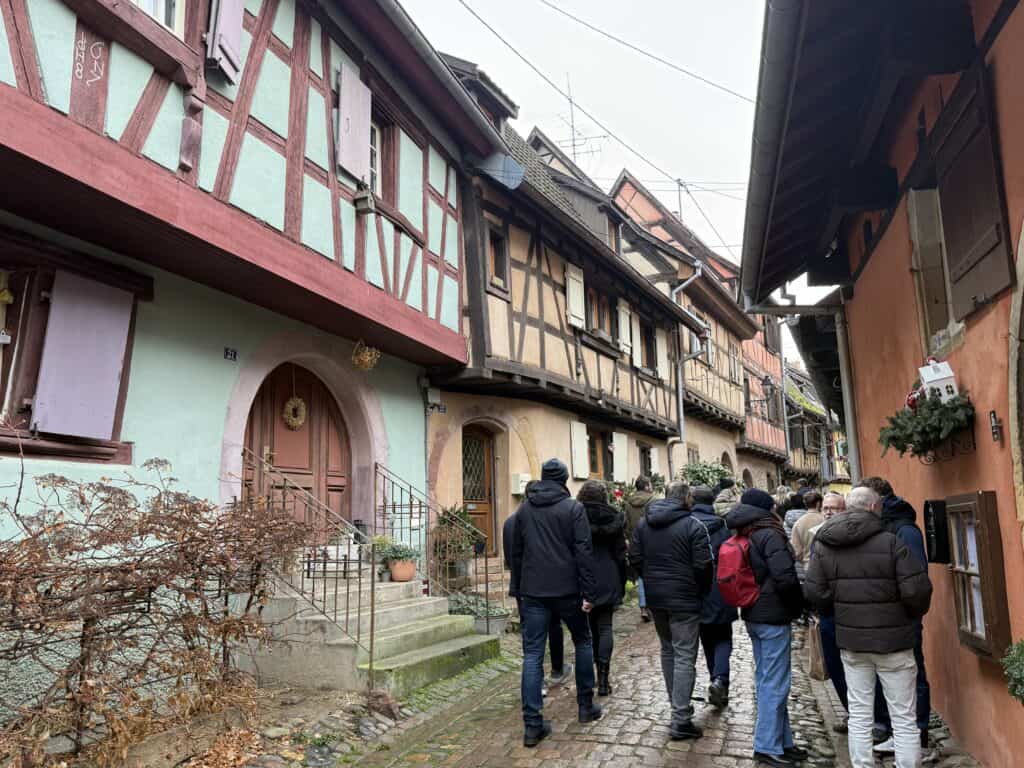 Eguisheim Christmas Market 2026: The Most Beautiful Village in Alsace Delivers 4 Pastel colored houses in Eguisheim France
