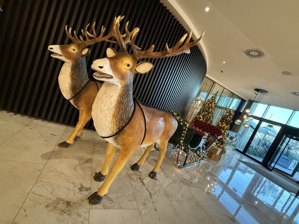 Ghent Christmas Market 2026: Belgium's Best Kept Secret 27 Sleigh and reindeer in the lobby of the Van der Valk Hotel in Ghent
