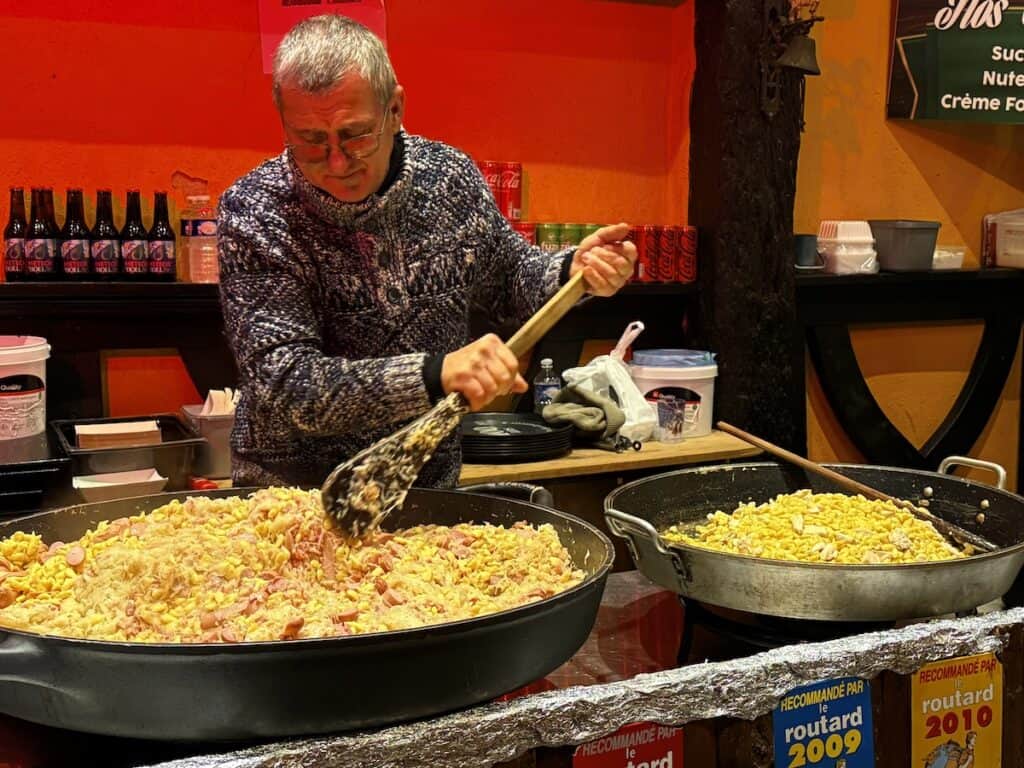 Riquewihr Christmas Market 2026: The Most Medieval Market in Alsace 12 Huge pans of tartiflette and spaetzle at the Riquewihr Christmas market