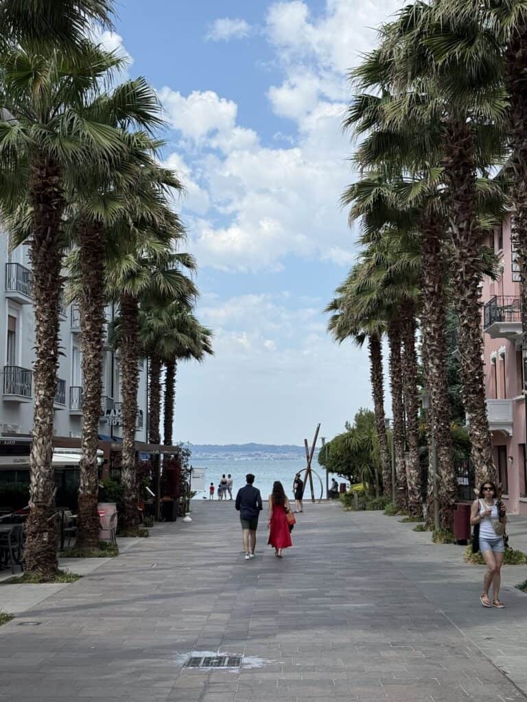 Lake Garda from Verona: Why Sirmione is the Best Day Trip 7 Couple walking in Sirmione