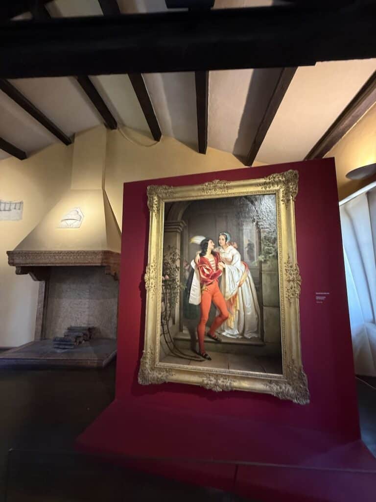 Juliet's Balcony in Verona: New Entrance, New Fee, Still Worth It in 2026? 3 An oil painting of Romeo and Juliet in Juliet's House in Verona