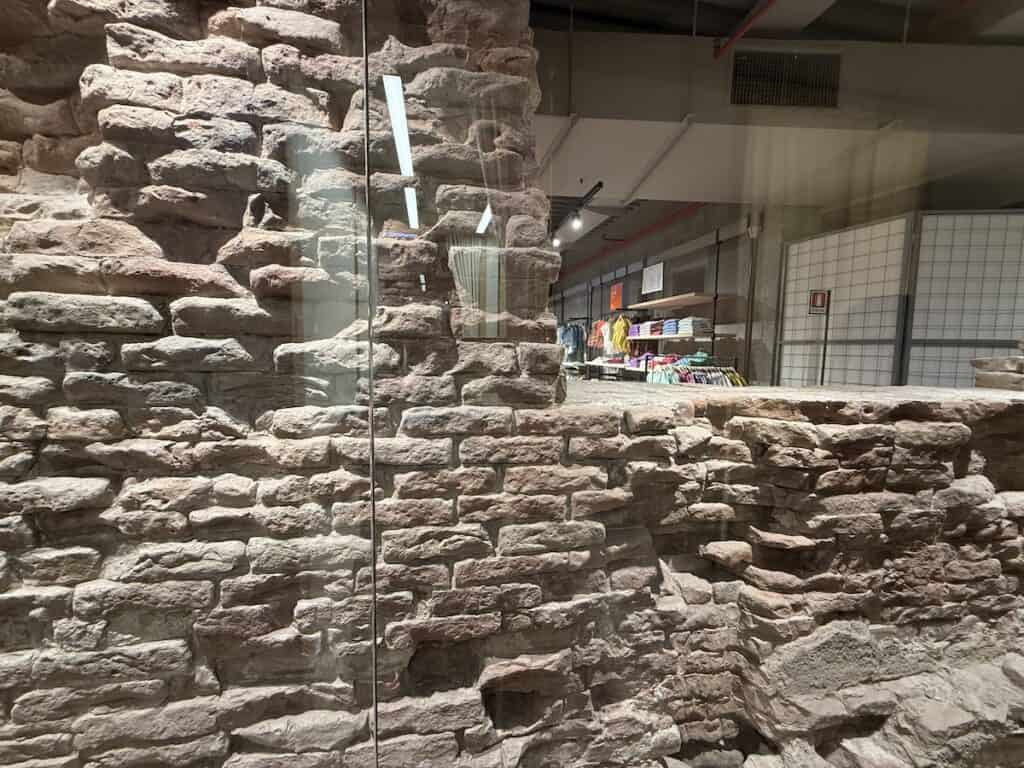 Things to Do in Verona: A 4-Day Guide Beyond Romeo and Juliet 9 An old medieval wall in a department store in Verona Italy